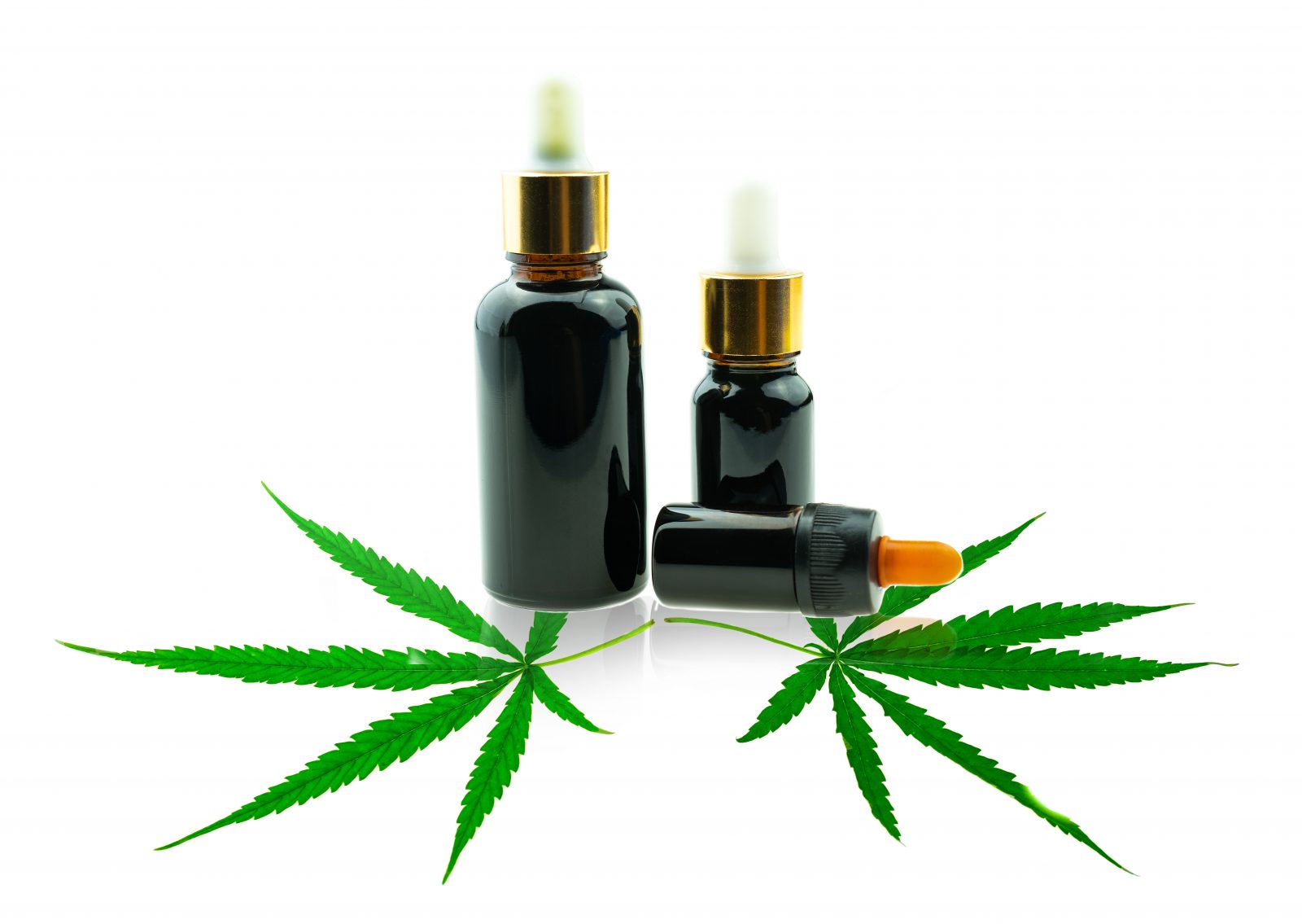 Garrafa com óleo de CBD e folha de cannabis Por thichaa